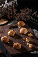 Fototapeta na wymiar Small snack cheese bread with black wooden