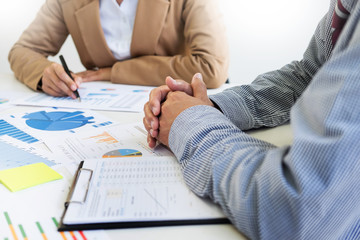 Team work process. young business managers crew working with new startup project. laptop on wood table, typing keyboard, texting message, analyse graph plans