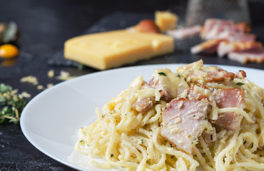 Pasta Carbonara with bacon, basil and cheese