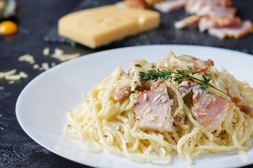 Pasta Carbonara with bacon, basil and cheese