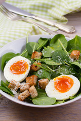 Boiled egg with toasted bread, spinach and parmesan cheese for breakfast. Breakfast meal, vertical