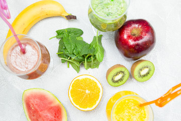 Energy and freshness for the whole day with fruit and berry smoothies with fresh kiwi, banana, orange, apple and spinach. Healthy food, Diet, Fitness concept