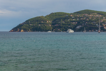Panoramic view on the yachts in the harbour of the Theoule sur Mer located on the waterfront seen from Mandelieu-la-Napoule, France, Europe