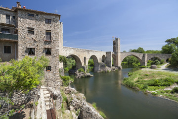 Fototapeta na wymiar Village view,river and romanesque bridge in medieval village of Besalu,Catalonia,Spain.