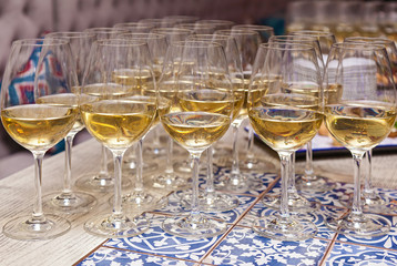 Close-up the glasses of the champagne on a table