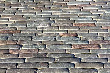 Abstract background old cobblestone pavement close-up perspective view