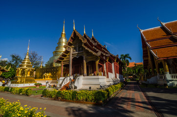 Fototapeta na wymiar Old Church and golden pagoda at phra singh temple