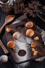 Small snack cheese bread with black wooden