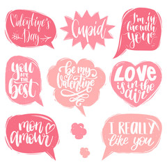 Vector hand lettering phrases Love Is In The Air, Cupid etc. February 14 calligraphy in speech bubbles.