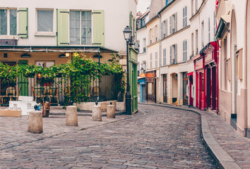 View of cozy street in quarter Montmartre in Paris, France - obrazy, fototapety, plakaty