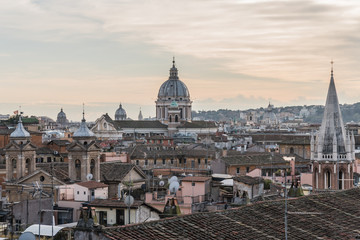 Fototapeta na wymiar Cityscape of Rome, Italy. Roofs and of domes of cathedrals