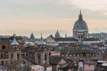 Fototapeta na wymiar Cityscape of Rome, Italy. Roofs and of domes of cathedrals