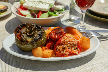 Rise stuffed fresh tomato and pepper in greek tavern.