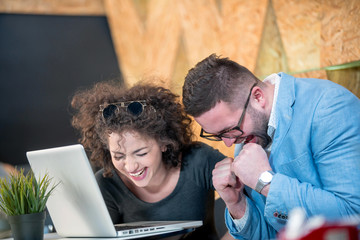 Fototapeta premium Couple discussing business at a coffee shop with hookah