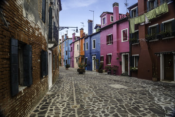 Burano, Venice. Colorful houses architecture, Burano island canal and boats, Italy