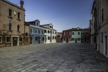 Fototapeta na wymiar Burano, Venice. Colorful houses architecture, Burano island canal and boats, Italy