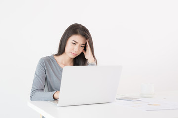 Asian women with stress from work in the office.