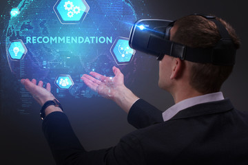 Business, Technology, Internet and network concept. Young businessman working on a virtual screen of the future and sees the inscription: Recommendation
