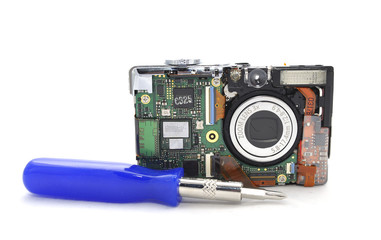 Digital camera disassembled on white background closeup 