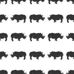 Rhino seamless. Wild animal wallpaper. Stock vector rhinoceros pattern isolated on white background. Monochrome Vintage hand drawn design