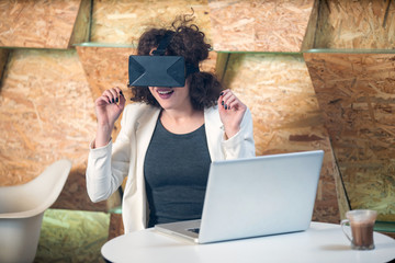 Girl using VR glasses having fun