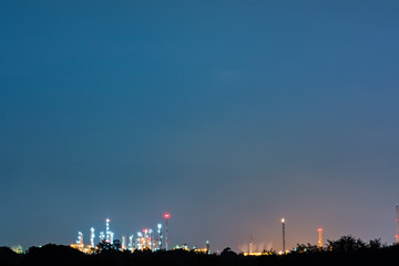 Fototapeta premium Oil and gas refinery plant area at twilight