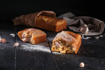 Homemade mini bread with fillers on dark wooden surface