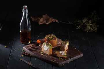 Homemade carrot cakes with pecans on dark wooden