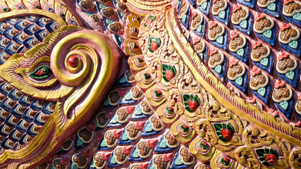 colorful fish scale art sculpture close up lanna style at Wat Ban Den, Chiang Mai, Thailand