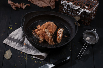 Top view of home strudel with chicken in frying pan