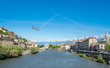 Fototapeta na wymiar Grenoble-Bastille cable car, four bubbles on sling, transport to hill and fortress of Bastille cross Isere river in Grenoble, France