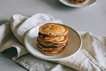 Banana pancakes with walnuts on a white background. Morning breakfast