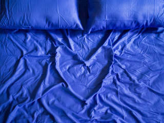 Love heart shape on blue color bedspread