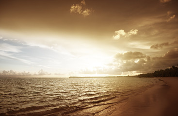 Naklejka na ściany i meble sunset on the beach of caribbean sea
