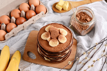chocolate pancakes with bananas on top