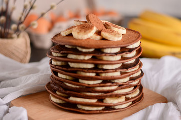 chocolate pancakes with bananas on top