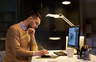 man with notepad working at night office