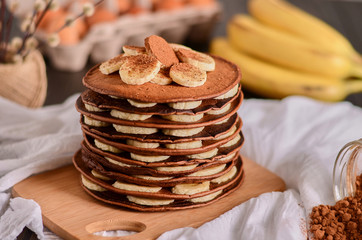 chocolate pancakes with bananas on top