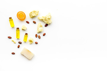 Cocoa butter for skin care. White background top view copy space