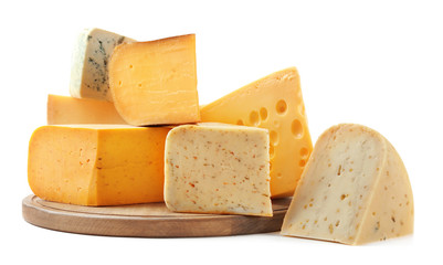 Different types of delicious cheese on white background