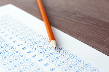 Pencil and test sheet on table, closeup. Preparation for exam