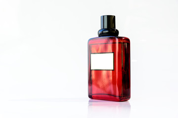 Red perfume glass bottle on white bakground or  isolated