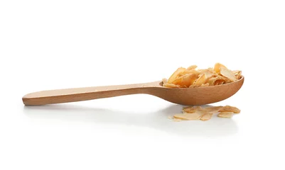 Foto op Plexiglas Dried garlic flakes in spoon on white background © Africa Studio