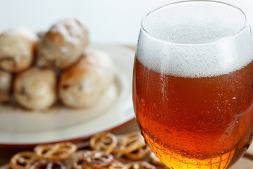 Beer glass with german pretzel and sausage