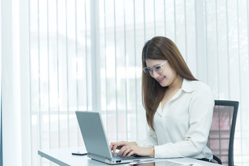 Asian business woman use laptop for work on the desk,Working in the workplace,Thailand people