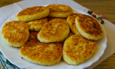 pancakes made of cottage cheese, made at home, on a plate.