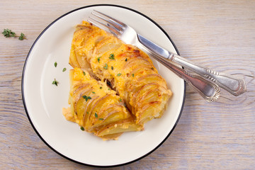 Potato gratin. Baked potato slices with creamy sauce. View from above, top, horizontal