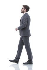 side view confident businessman goes forward.