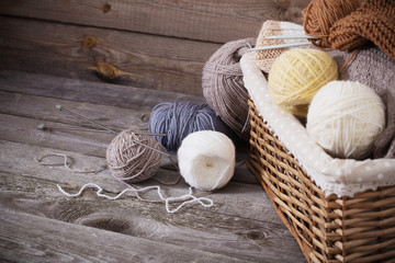 Fototapeta na wymiar Knitting and knitting needles on a wooden surface