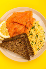 Smoked Salmon and Scrambled Eggs With Rye Bread and Lemon Breakfast